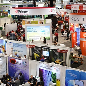IFT FIRST exhibitors at booths and attendees walking the expo floor
