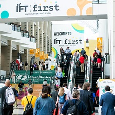 Numerous attendees walking into the IFT FIRST welcome entrance at McCormick Place Chicago
