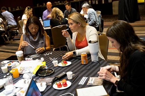 IFT FIRST Short Courses people at a table smelling ingredients