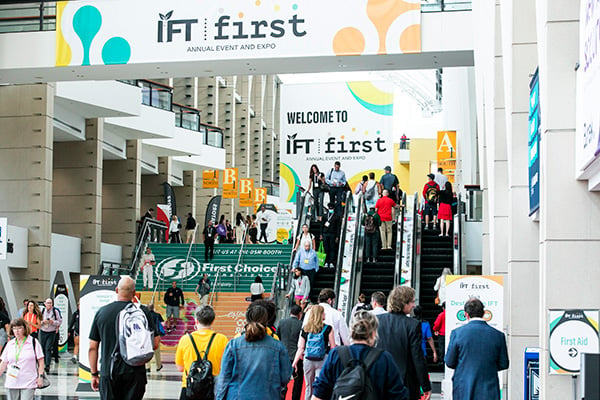A big crowd of attendees walking into IFT FIRST at McCormick Place in Chicago