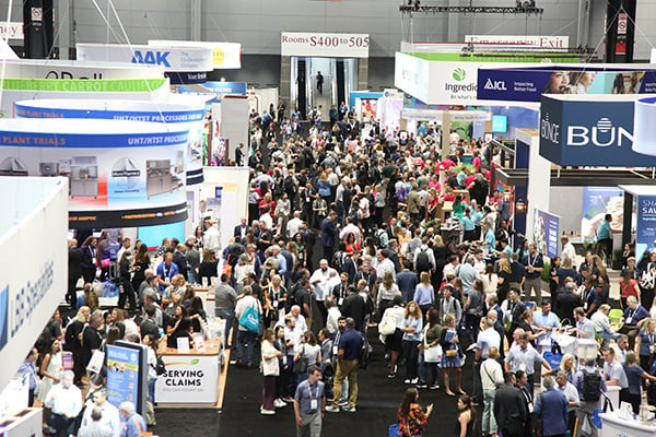 Bustling expo floor of exhibitor booths and attendees at IFT FIRST