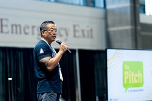 A person on stage pitching their startup during The Pitch competition at IFT FIRST