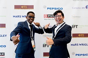 Two students posing happily in the student lounge at IFT FIRST