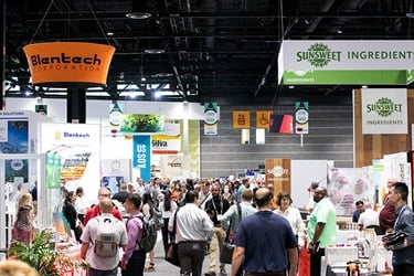 IFT FIRST attendees walking through industry exhibitor booths